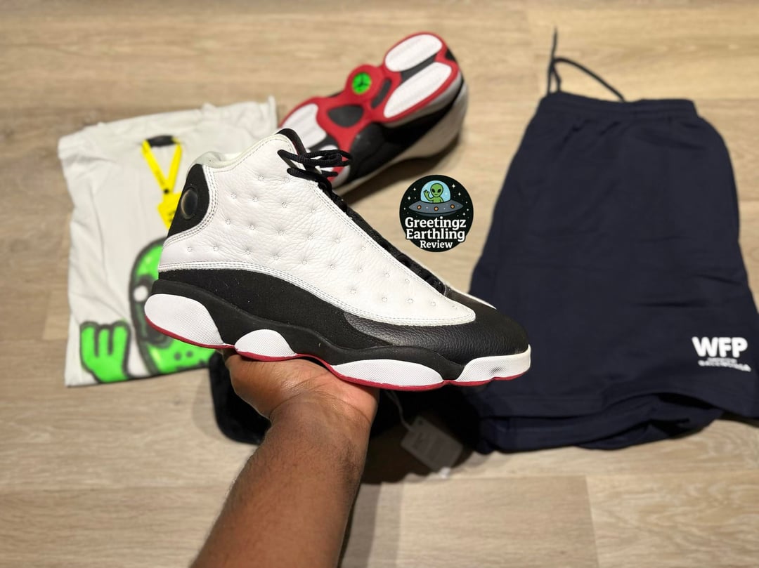 Bargain haul with Jordan 13 sneakers, alien graphic T-shirt, blue shorts and waist bags — photo 6