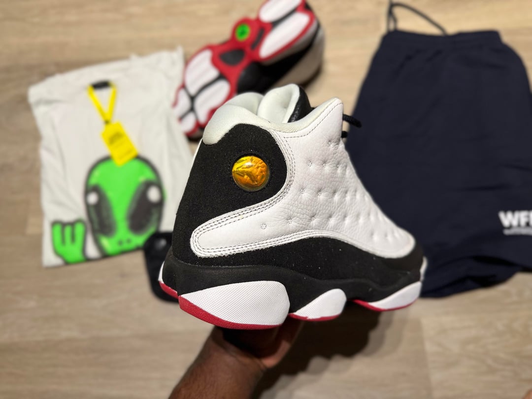 Bargain haul with Jordan 13 sneakers, alien graphic T-shirt, blue shorts and waist bags — photo 7