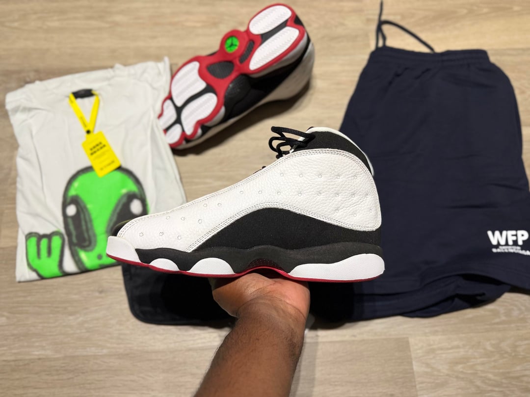 Bargain haul with Jordan 13 sneakers, alien graphic T-shirt, blue shorts and waist bags — photo 8